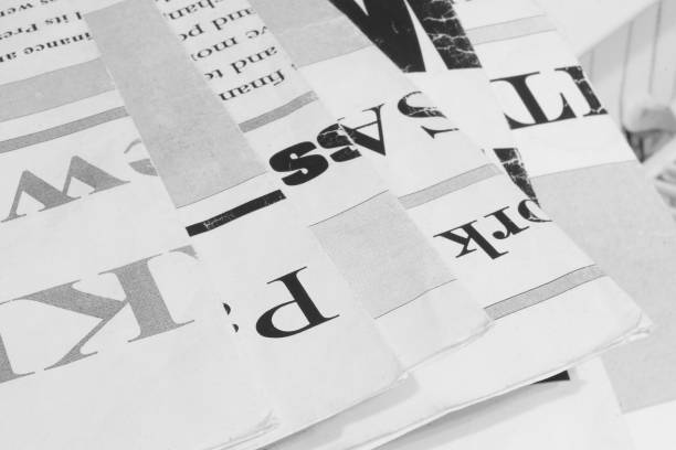 istock Newspaper Pages with Headlines and Articles 1191401155