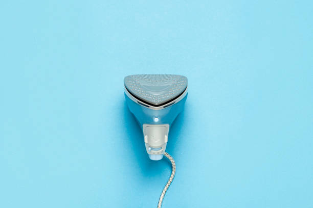 istock Iron for ironing things and linen on a blue background. Laundry concept, atelier. Flat lay, top view 1191401532