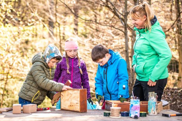 istock Children making wooden boxes 1191402286