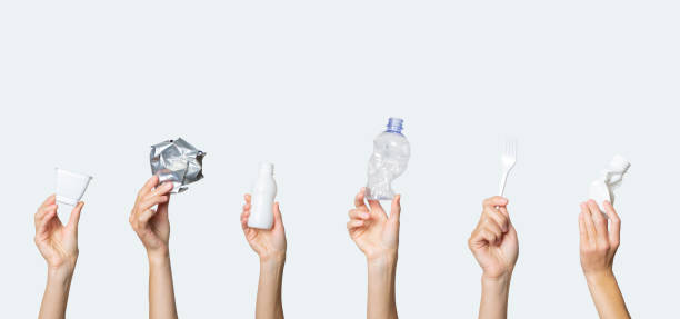 istock Hands hold trash on a light background. The concept of separate trash, stop plastic, recycling 1191402388