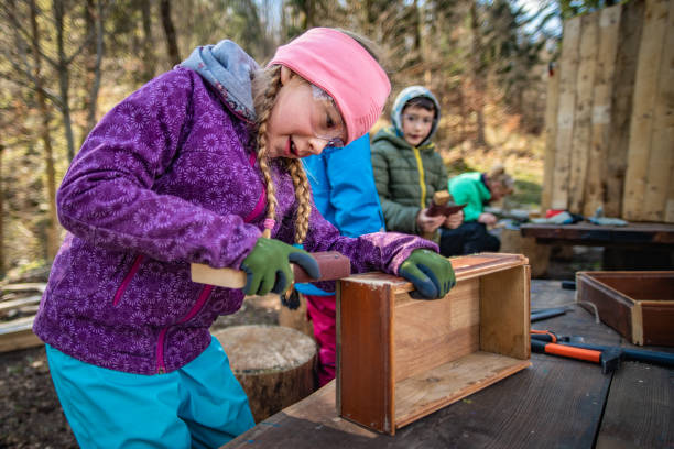 istock Girl making wooden box 1191402533