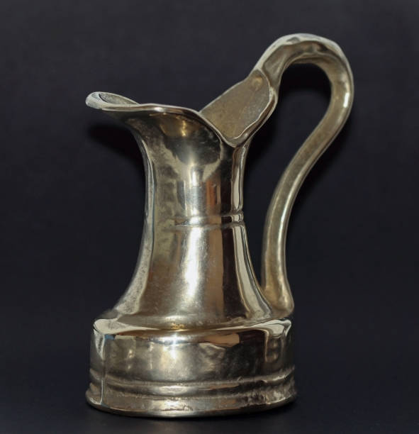 istock Old Small brass dish on the black background 1191404225