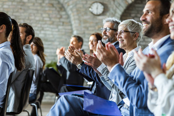 istock Happy entrepreneurs applauding on education event in board room. 1191405362