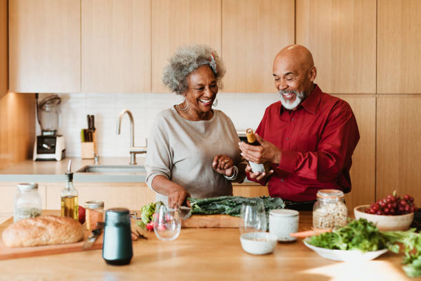 istock Smiling senior couple looking at wine bottle 1191405416