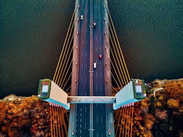 istock Beautiful panoramic aerial drone view to cable-stayed Siekierkowski Bridge over the Vistula river and Warsaw City skyscrapers, Poland in gold red autumn colors in November evening at sunset 1191405449