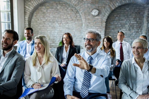 istock Happy mature businessman asking a question on seminar. 1191405468