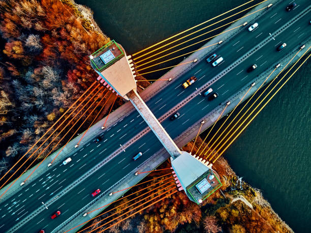 istock Beautiful panoramic aerial drone view to cable-stayed Siekierkowski Bridge over the Vistula river and Warsaw City skyscrapers, Poland in gold red autumn colors in November evening at sunset 1191405534