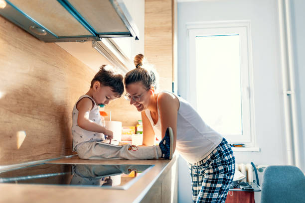 istock Mother and son connecting with a digital tablet 1191405630