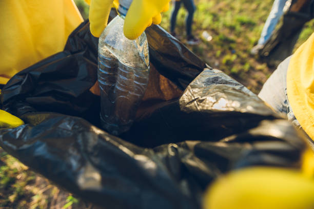 istock People cleaning up garbage in nature 1191407687
