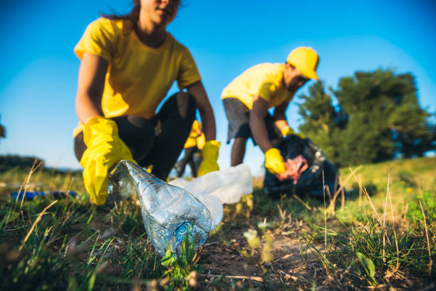 istock People cleaning up garbage in nature 1191407929