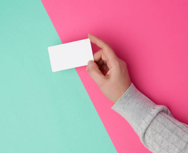 istock female hand holding empty white paper business 1191407932