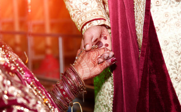 istock Indian Bride & Groom holding hands 1191408685