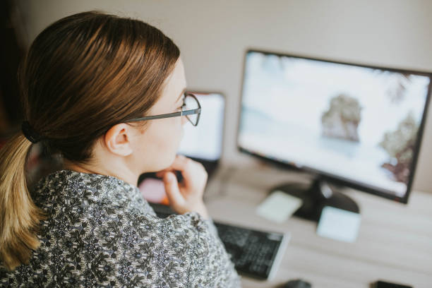 istock Close up of a young woman working on her computer 1191409442