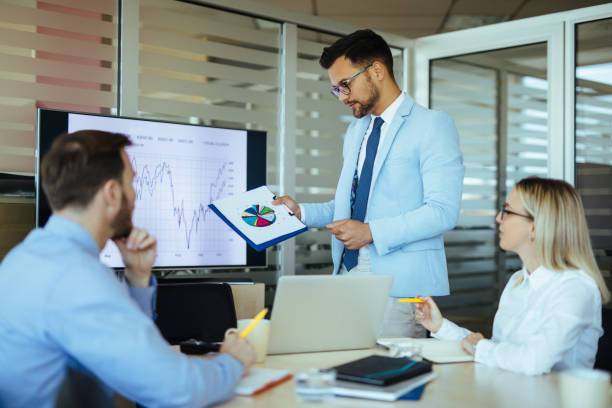 istock Businessman leading presentation in meeting room 1191409879