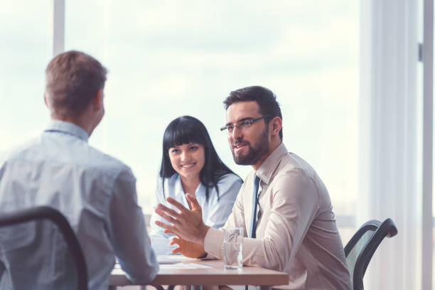 istock Smiling business people at meeting 1191409969