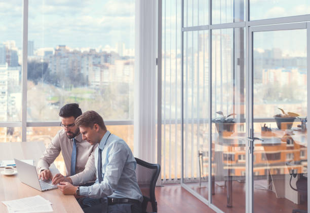 istock Business people signing a contract 1191410097