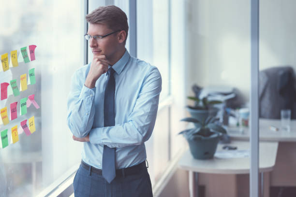 istock Young businessman by the window 1191410119