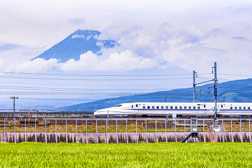 Japan - July 2019 : High Speed Train passing Fuji Mountain Background in Summer, Fuji City, Shizuoka, Japan