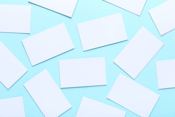 istock Blank business cards on blue background 1191411849