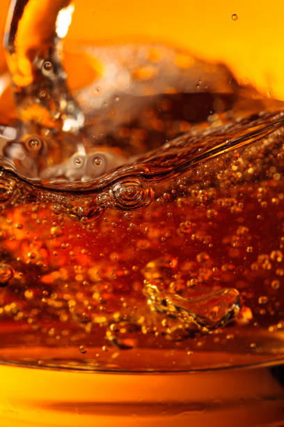 istock Whisky is poured into a glass with ice. 1191412876