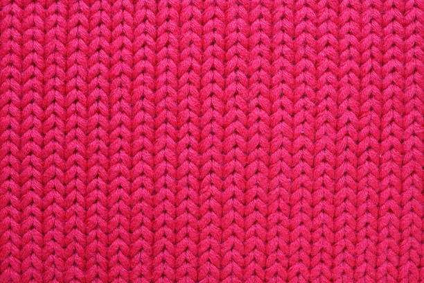 istock Red knitted texture closeup. Abstract woolen fabric background. 1191413406
