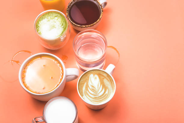 istock Cups of coffee, tea, juice and water. Morning drinks for different preferences. Top view. 1191414113