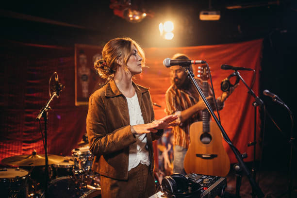 istock Man and woman musicians on stage 1191414327