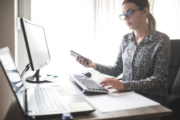 istock Young businesswoman in multitasking 1191414402