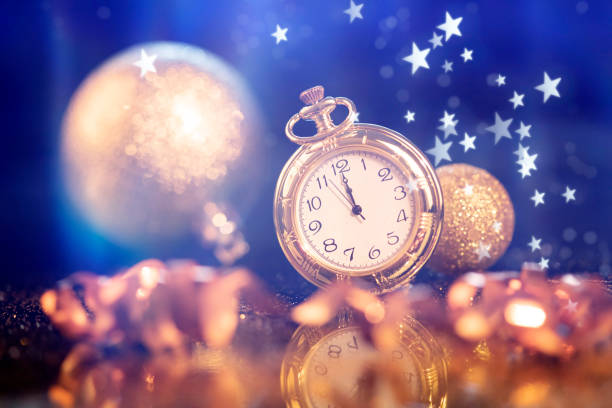 istock New Year's at midnight - Old clock with holiday lights 1191417088