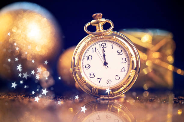 istock New Year's at midnight - Old clock with holiday lights 1191417408