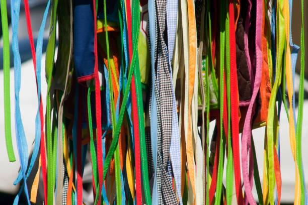 Display of multicolored ribbons in the sunlight. Market place.  Lugo, Galicia, Spain.