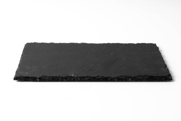 istock Black stone plate isolated on white background 1191417568