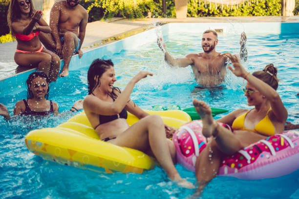 istock Friends at a poolside party 1191419558