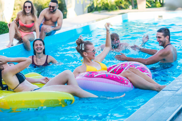 istock Friends at a poolside party 1191419593
