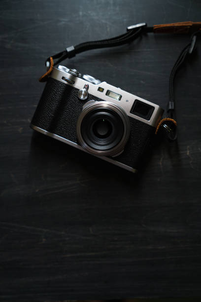 istock Old style digital cameras isolated on dark background 1191419870
