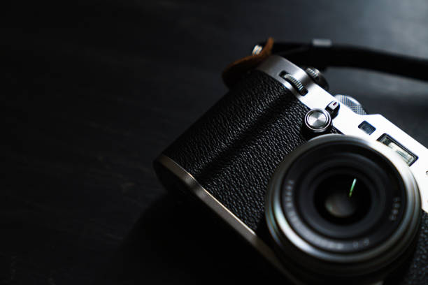 istock Old style digital cameras isolated on dark background 1191419905