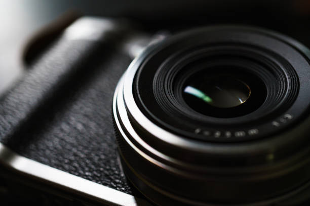 istock Old style digital cameras isolated on dark background 1191420178