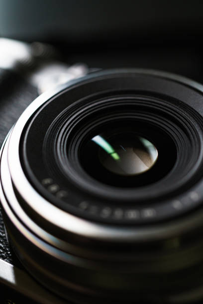 istock Old style digital cameras isolated on dark background 1191420183