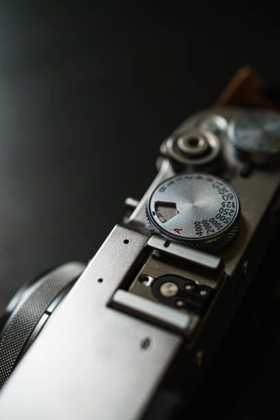 istock Old style digital cameras isolated on dark background 1191420260