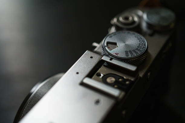 istock Old style digital cameras isolated on dark background 1191420272
