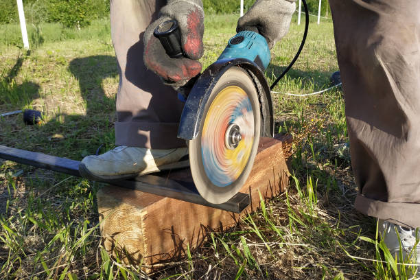 istock An angle grinder worker cuts a metal profile on the outside. 1191422013
