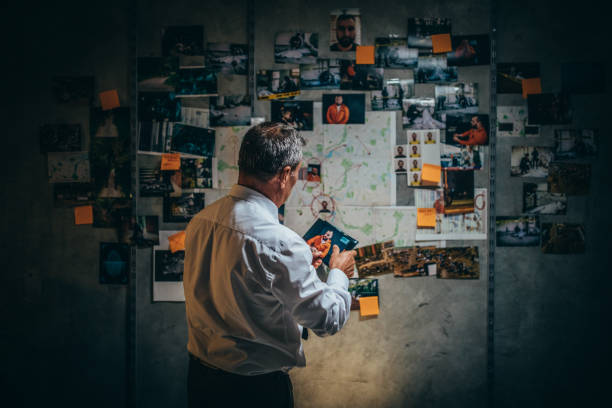 istock Mature detective working late on a case in office 1191426816