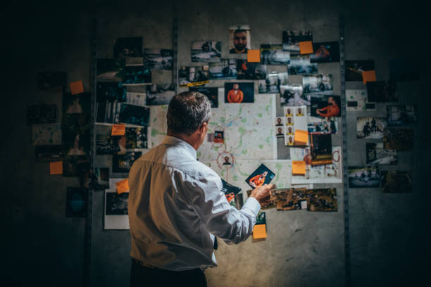 istock Detective working late on a case in office 1191426909
