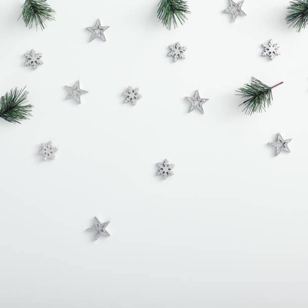 istock Pine branch, silver snowflake and starfall over white 1191427645
