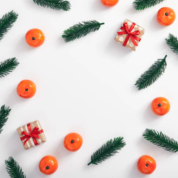 istock Christmas tree branch and tangerine 1191427866