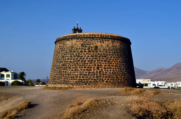 Lanzarote, Spain - January 15, 2012: Castle with bell tower named Castillo de Las Coloradas in Playa Blanca
