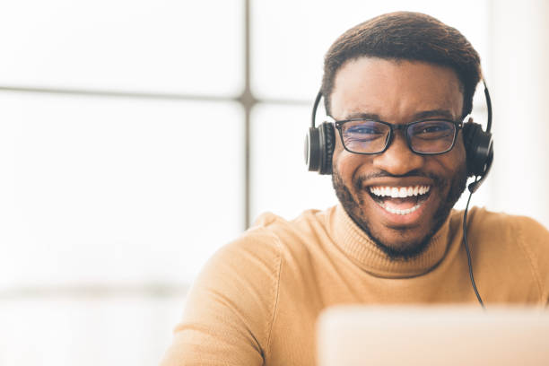 istock Closeup of happy african customer service agent 1191429681