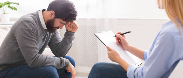 istock Desperate millennial man getting psychological help at therapist 1191429905