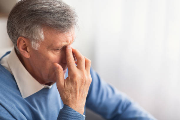 istock Desperate Elderly Man Thinking Sitting On Couch At Home 1191430950
