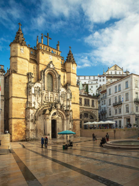 Santa Cruz Church and 8 de Maio Square in Coimbra, Portugal. Coimbra, Portugal - November 21, 2019: View with the sunlit church facade on an autumn afternoon. coimbra city stock pictures, royalty-free photos & images